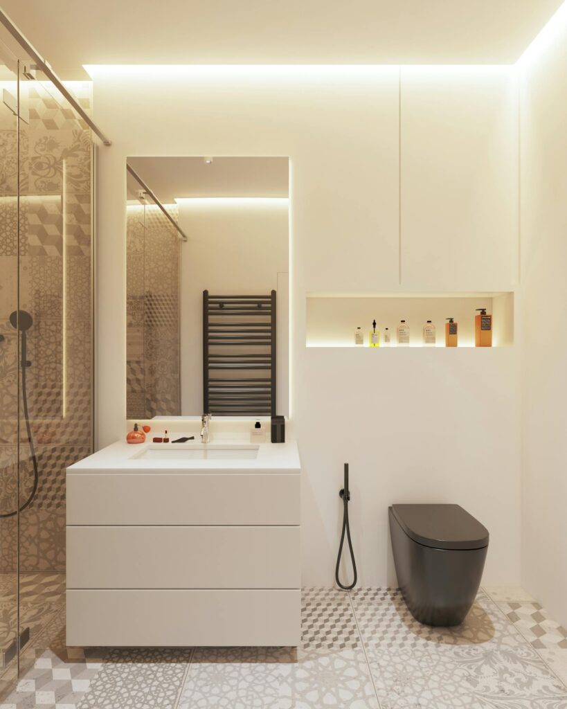 A sleek and stylish modern bathroom featuring a black toilet and geometric decor.